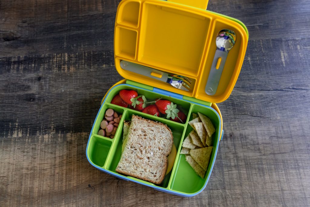 Easy toddler lunch on the go using the @munchkin bento box, lunch bag (SO  CUTE) and juicebox holder.