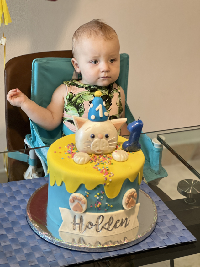 Toddler sitting in a travel booster seat