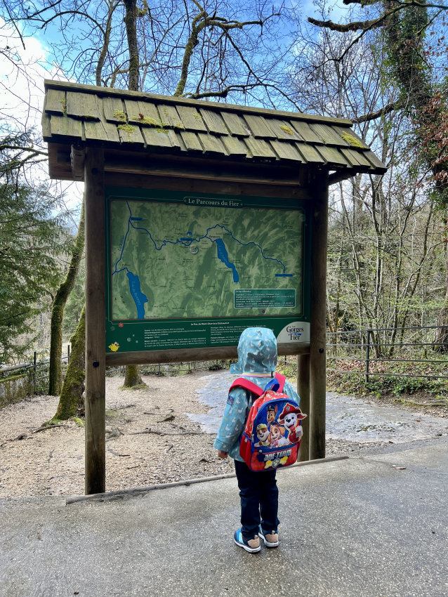 Toddler with his paw patrol backpack going on a hike.