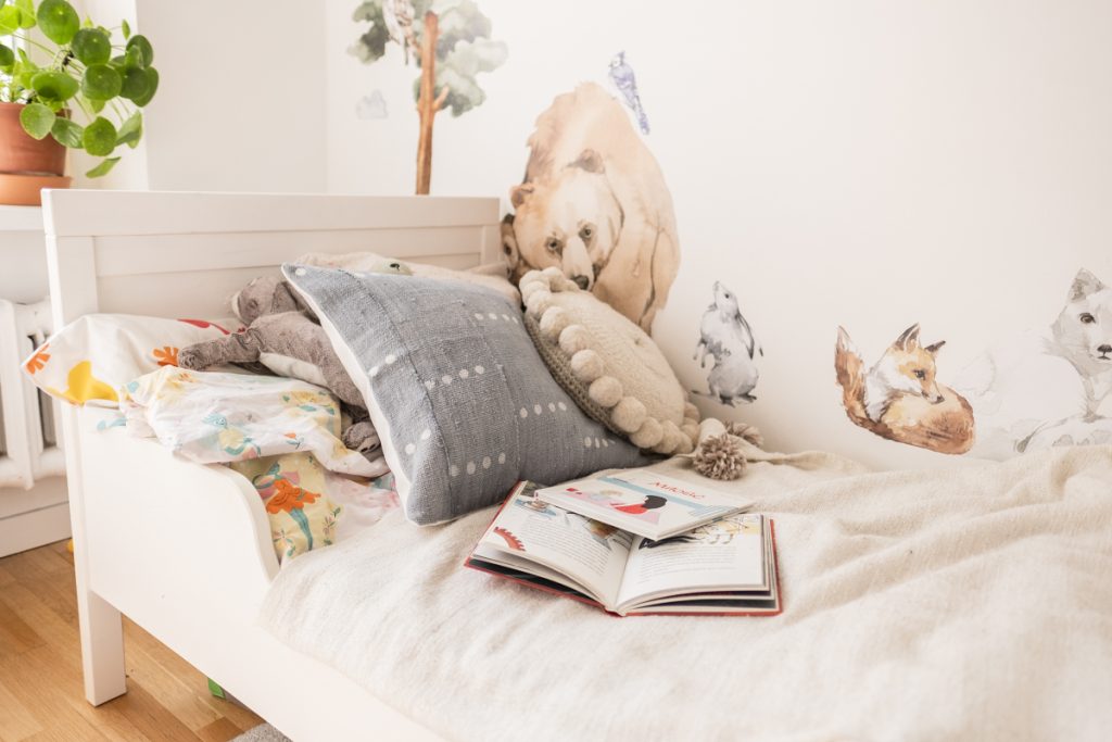 White colored montessori bed for young children.