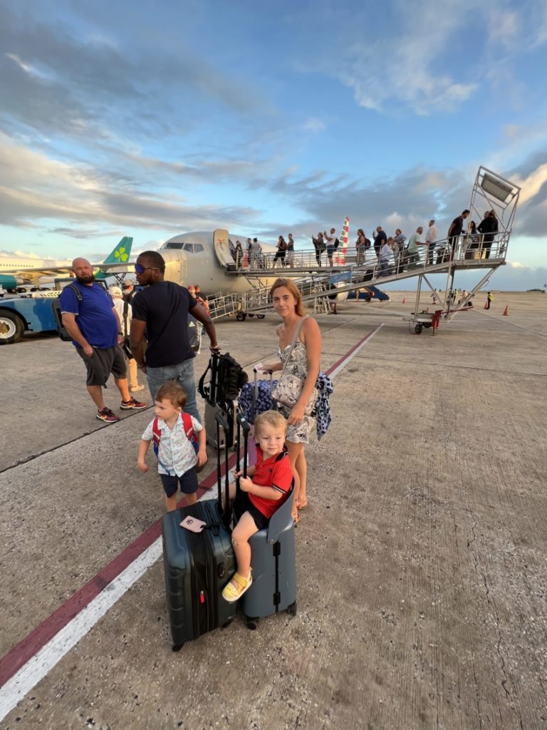 miamily suitcase at the airport in the Caribbean