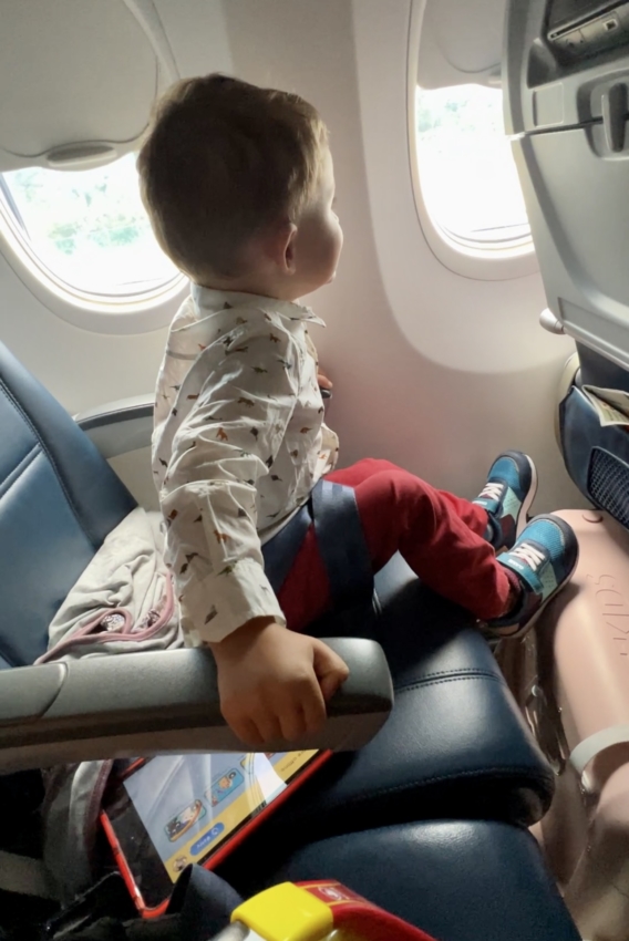 Stokke jetkids suit case under the seat on the plane