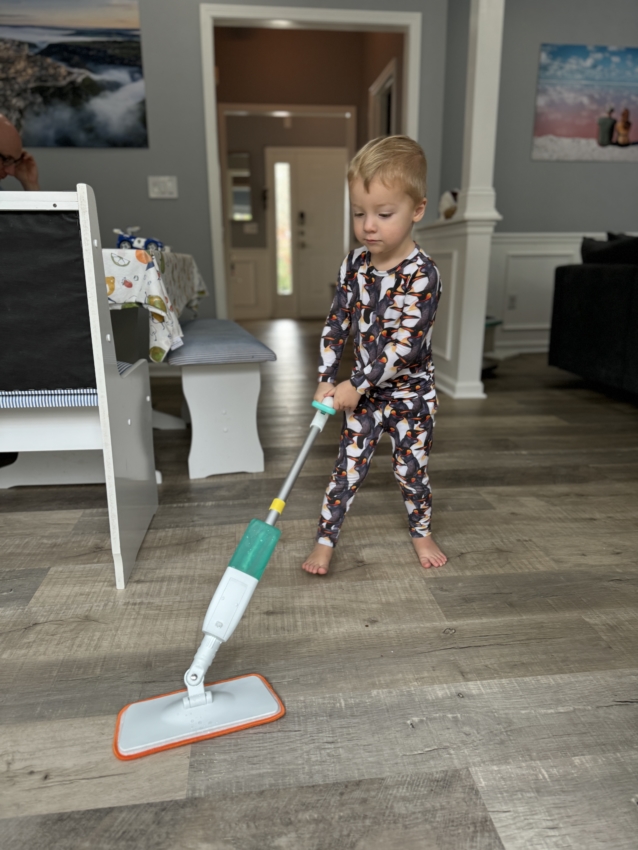 Preschooler doing chores